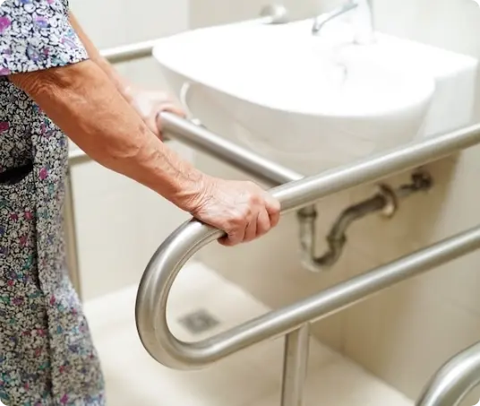 elderly-woman-using-sink-grab-rails